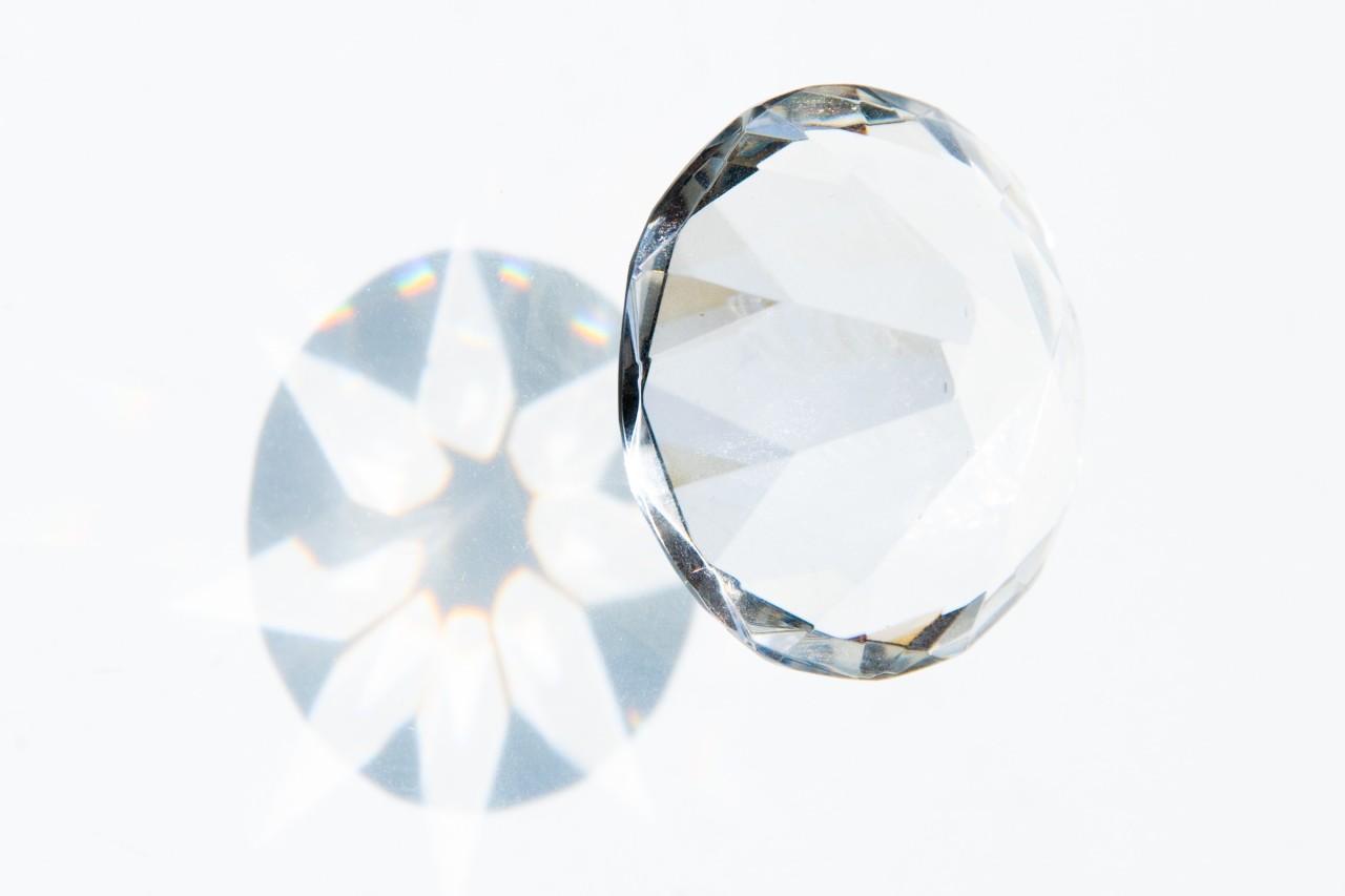 Close up image of a round cut diamond against a white background