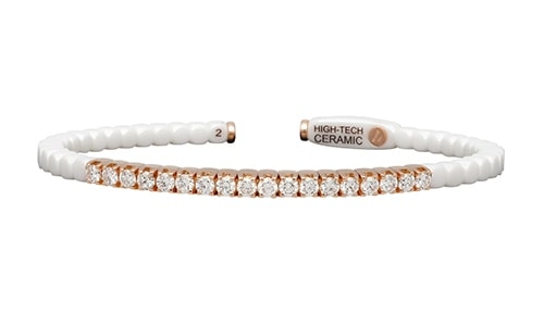 A white ceramic and rose gold diamond cuff bracelet from Roberto Demeglio