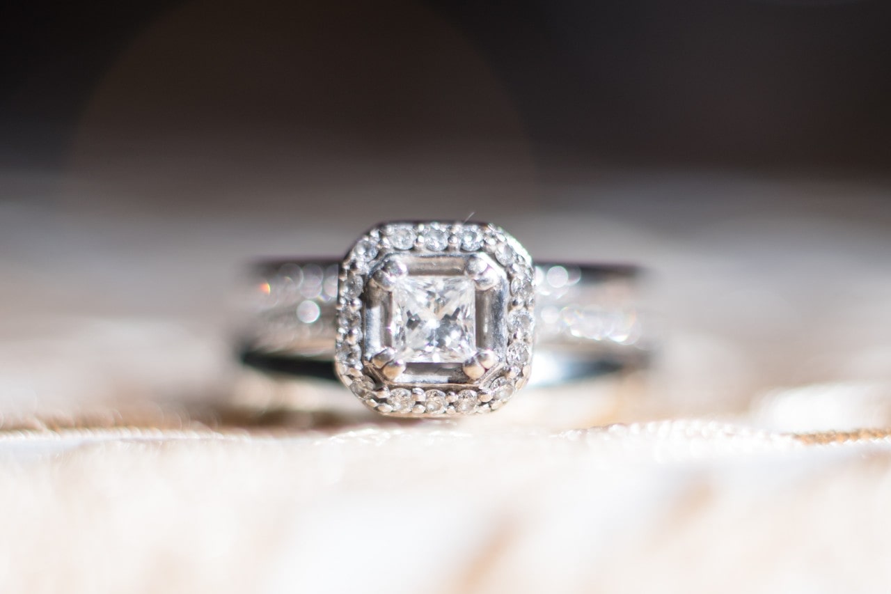Engagement ring with Asscher cut diamond in a halo setting