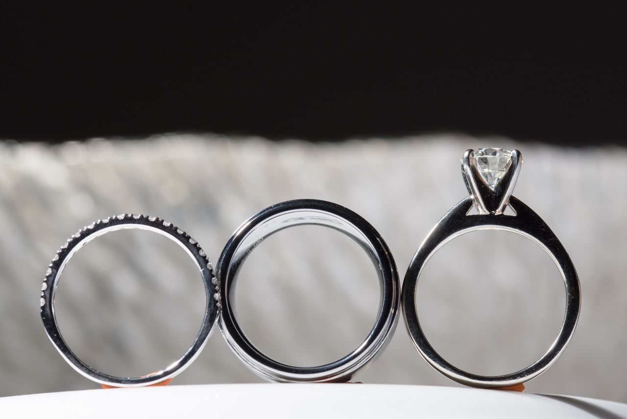 From the left: two wedding bands and a solitaire engagement ring